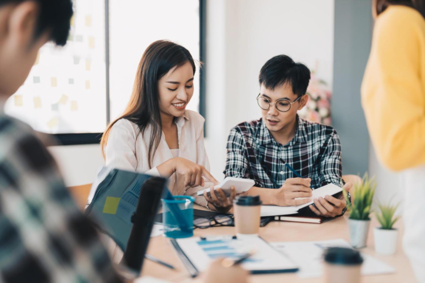 Financial planning team reviewing seasonal business data and budget forecasts